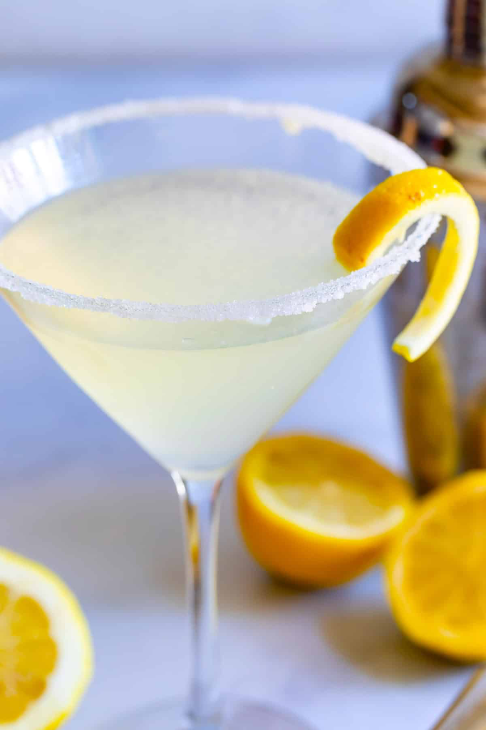 Lemon Drop Martini in sugar-rimmed martini glass with lemon zest garnish