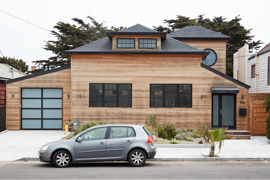 Great Highway Project in San Francisco with cedar exterior with black asphaltic roofing and aluminum and translucent glass garage doors.