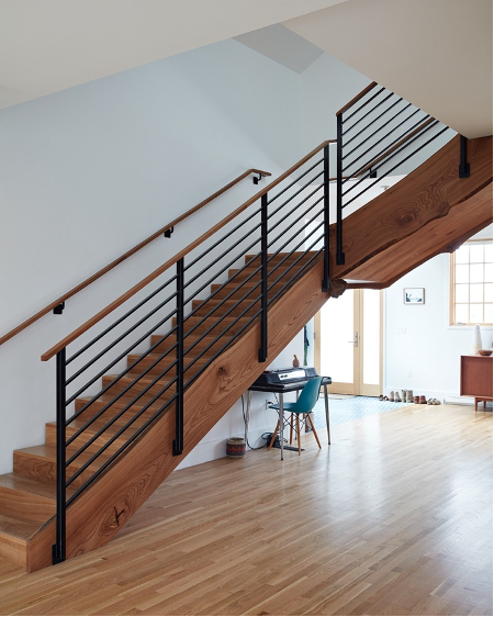 detail of walnut live-edge staircase in San Francisco surf pad