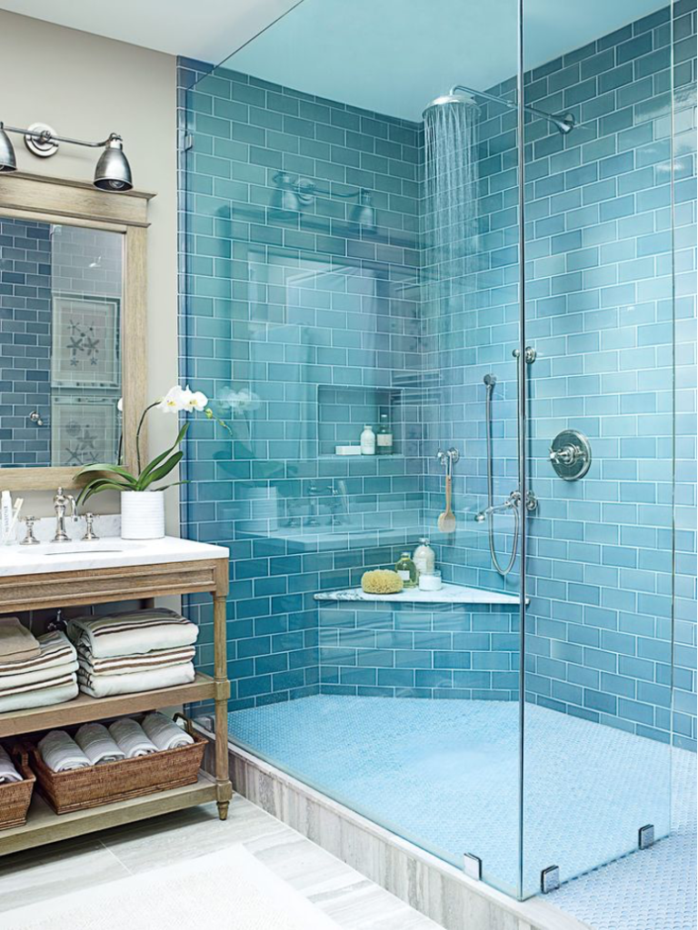 Small beach cottage bathroom with all-glass corner shower, open vanity cabinets, silver hardware