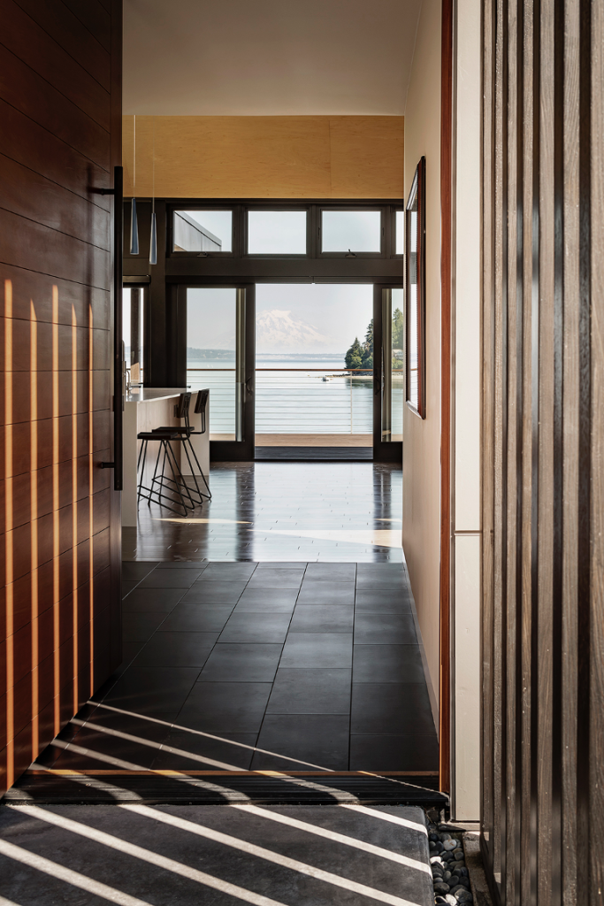 View of the entry way that flows through to the back of the home and features breathtaking view of Puget Sound and Mount Rainier