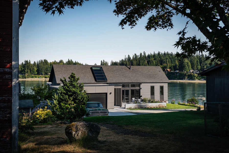 West side of house with patio area, landscaping, firepit and gardens with views of Puget Sound waters and landscape