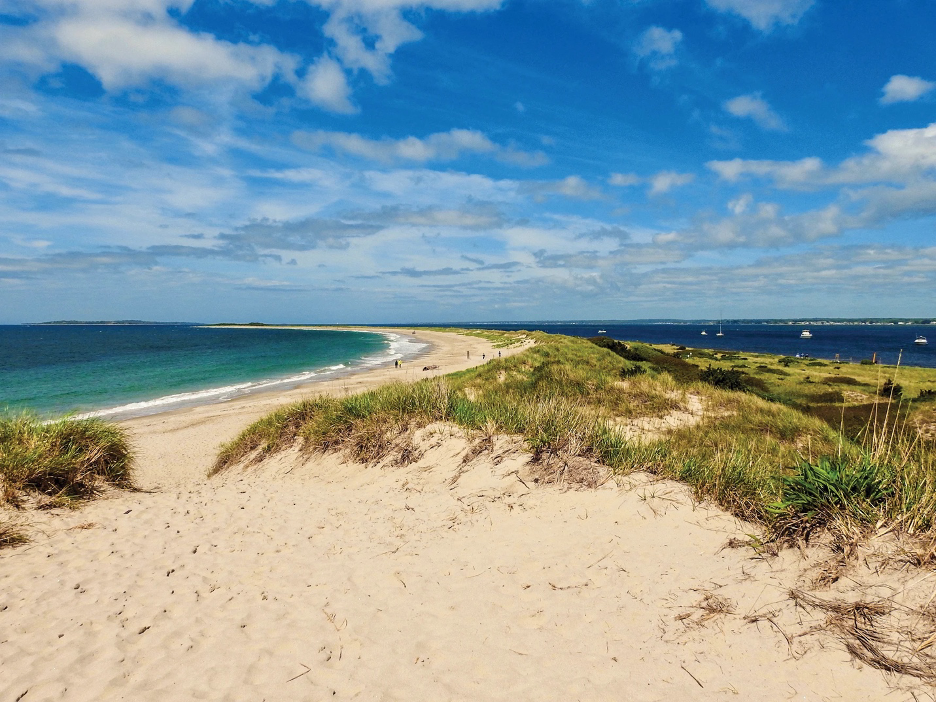 Napatree Point, located in Westerly, Rhode Island, is a narrow, undeveloped barrier beach that serves as a protected conservation area.