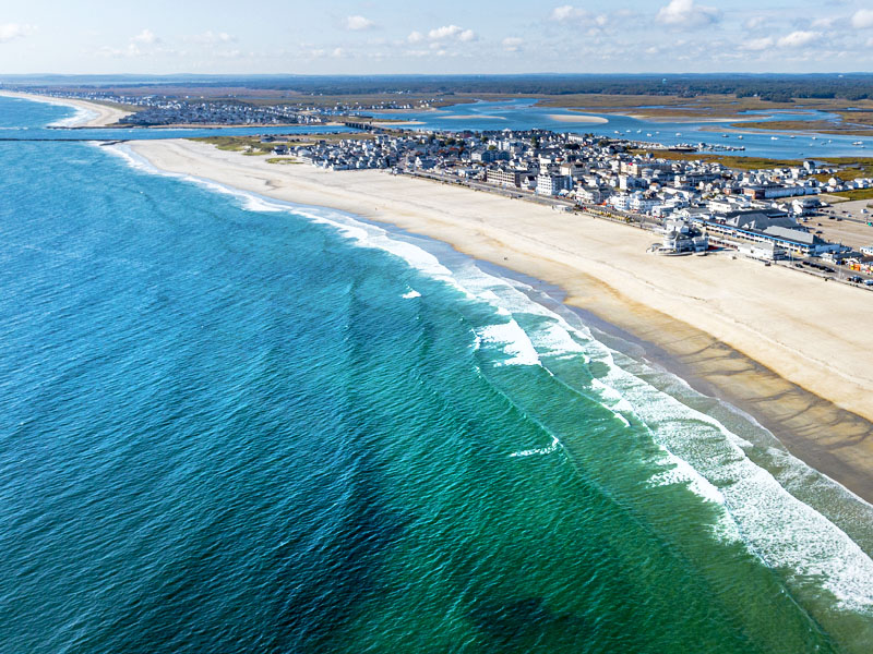 Hampton Beach, located in Hampton, New Hampshire, is a popular public beach known for its lively boardwalk and long stretch of sandy shoreline.